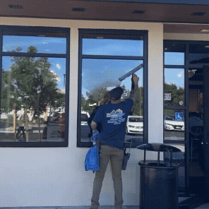 Owner of The Cleaning Source performing expert window cleaning